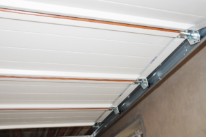 garage door roller replacement: garage door roller closeup