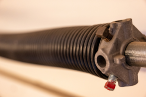 Garage door spring replacement service - close up of a garage door spring